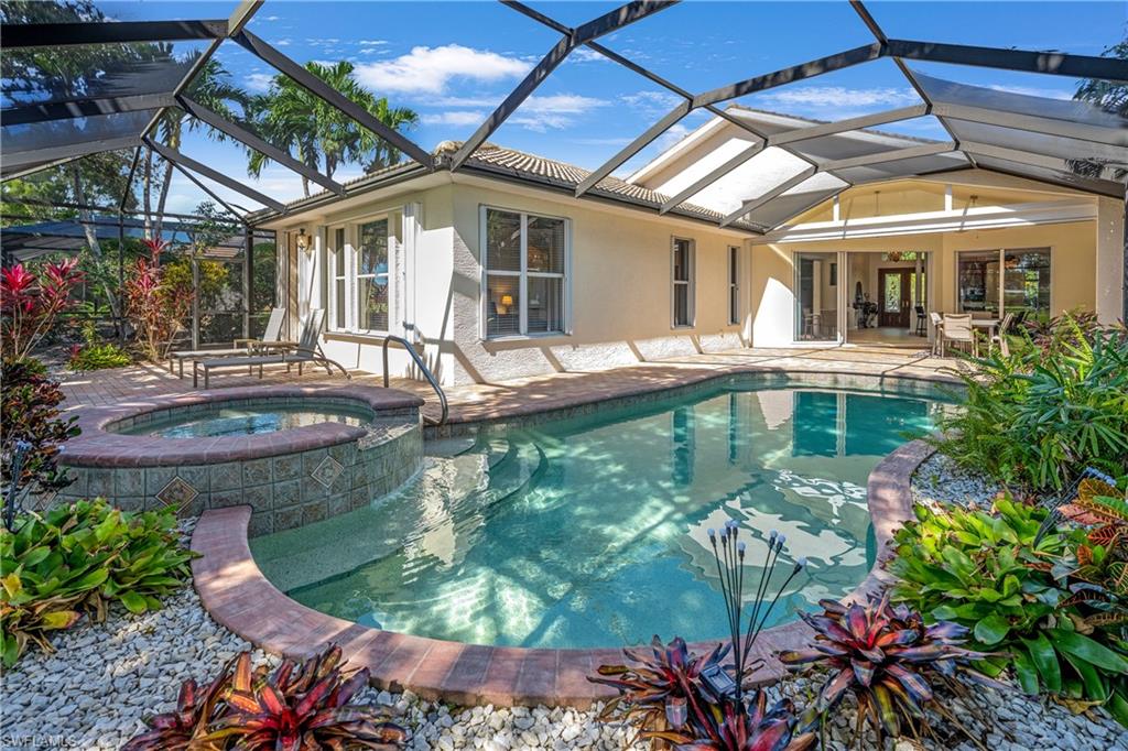 View of pool featuring a sunroom and a patio
