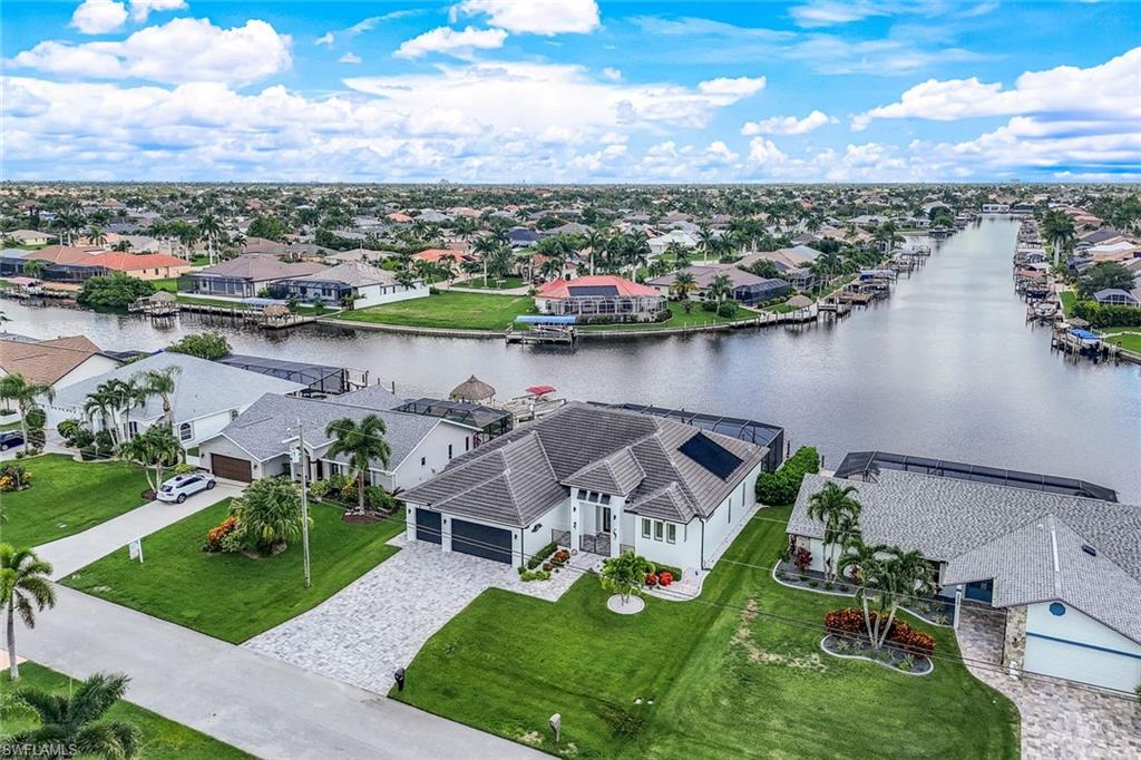 Aerial perspective of suburban area with a nearby body of water