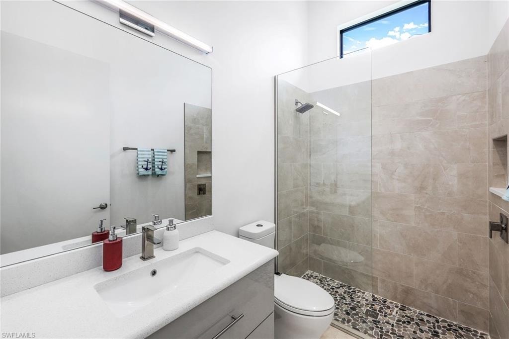 Full bathroom with vanity and walk in shower