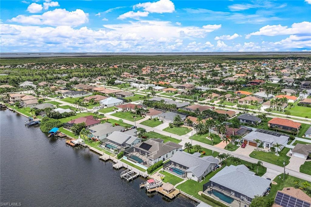 Aerial view of residential area with a large body of water