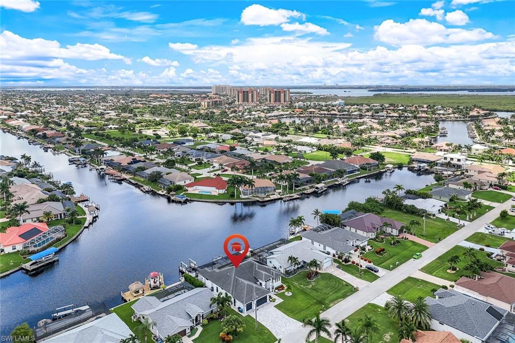 Aerial view of residential area with a large body of water