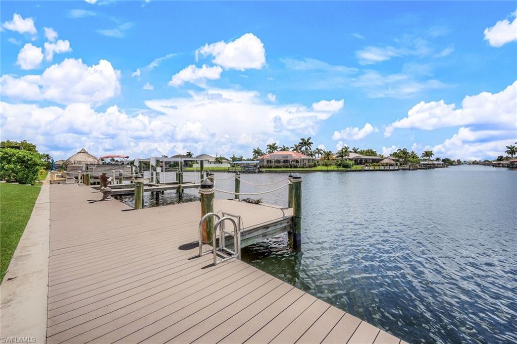 Dock area featuring a water view and boat lift