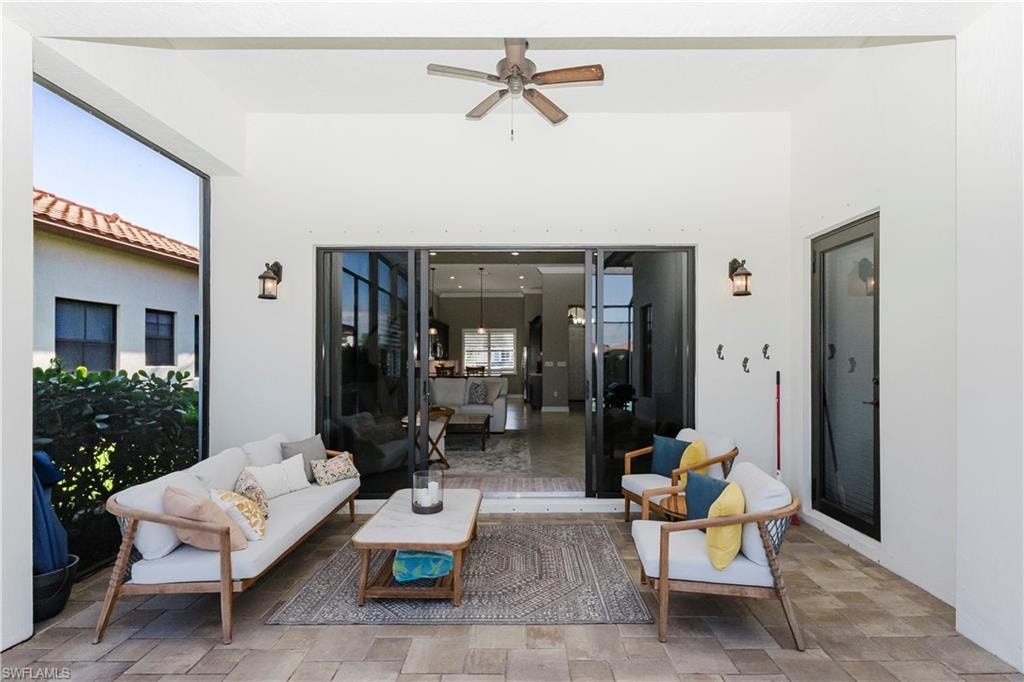 View of patio featuring a ceiling fan and outdoor lounge area