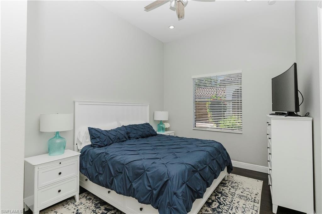 Bedroom featuring dark wood finished floors, recessed lighting, and a ceiling fan