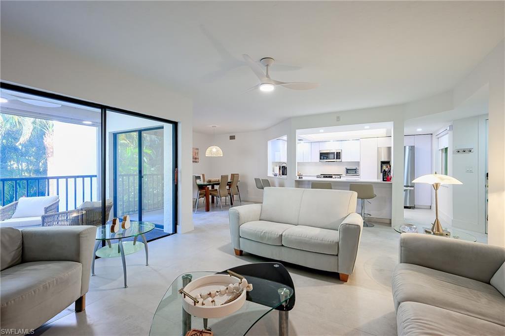 Living area featuring ceiling fan and healthy amount of natural light