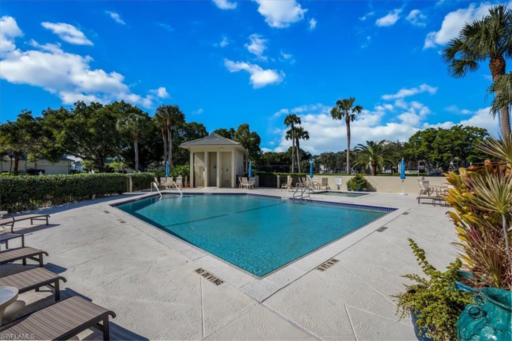 Community pool with a patio