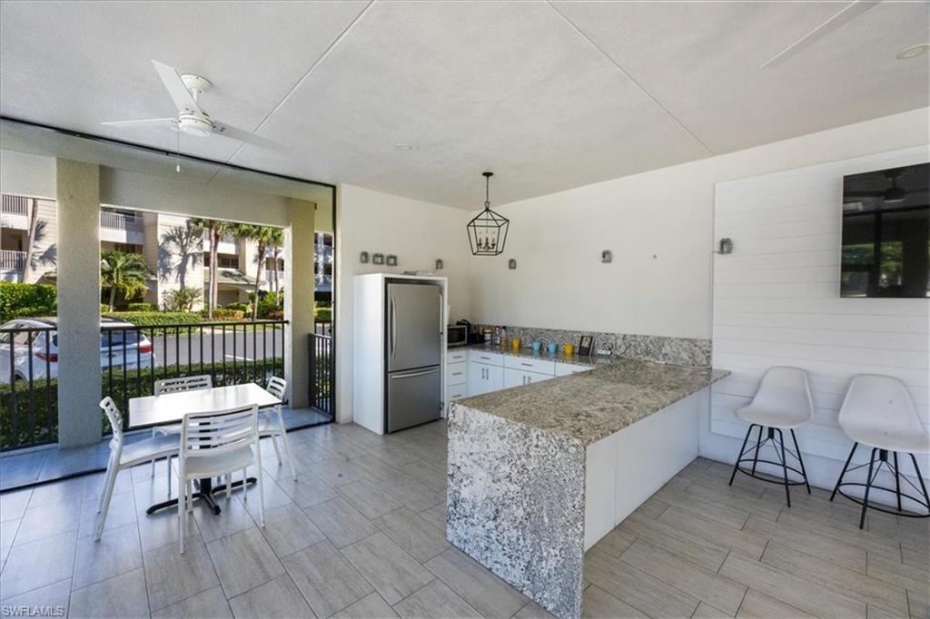 Community room by the pool and tennis courts