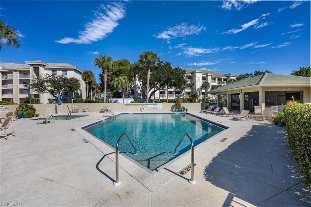 Community pool featuring a patio area