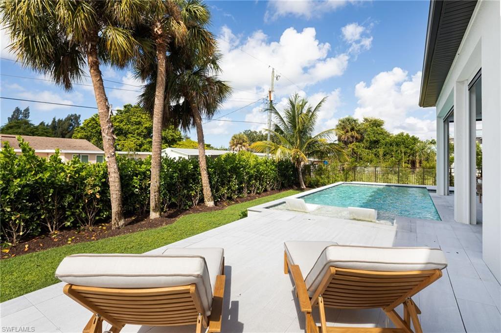 View of pool featuring a patio area and a fenced backyard