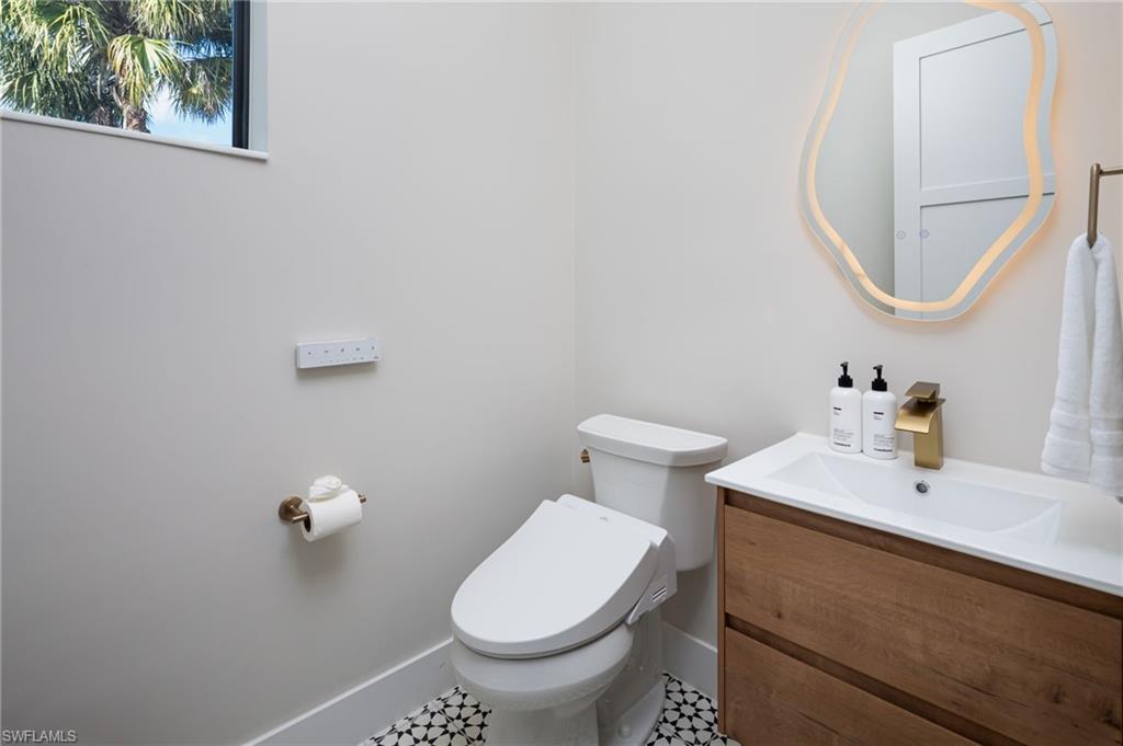 Bathroom with vanity and tile patterned floors