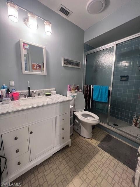 Bathroom featuring vanity and a shower stall