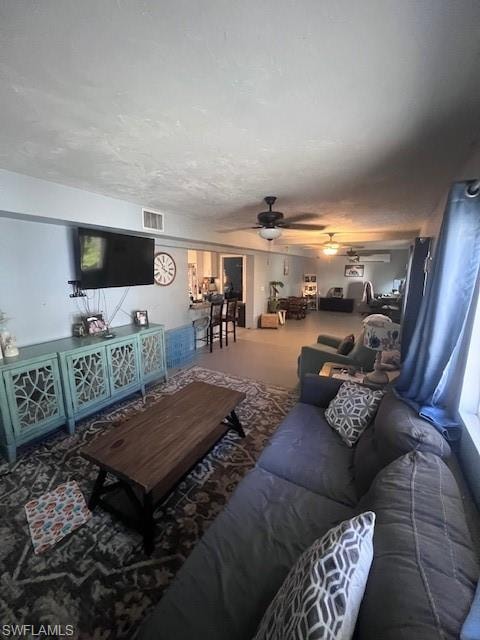 Living area featuring a ceiling fan