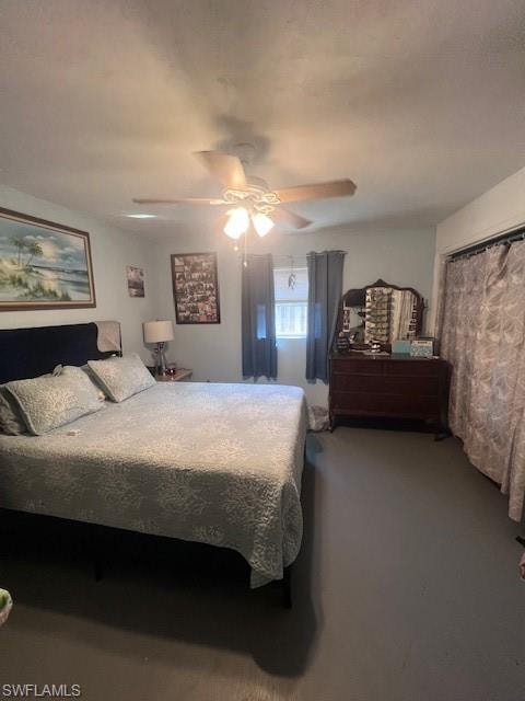Carpeted bedroom featuring ceiling fan