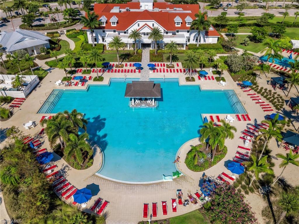 Drone / aerial view of the community pool. Lap Pool upper right hand corner. Clubhouse.