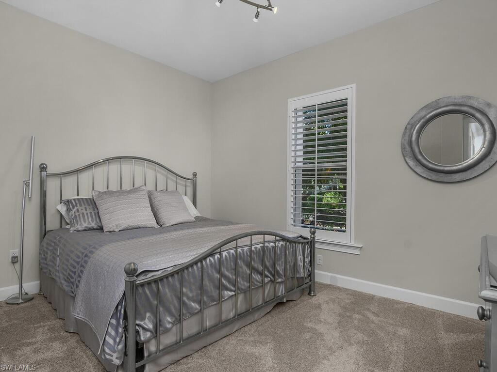 Guest Bedroom featuring Plantation Shutters, very neat and clean!