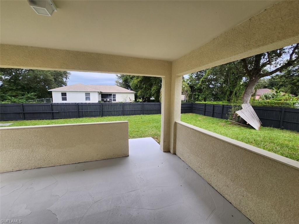 Fenced backyard with a patio area