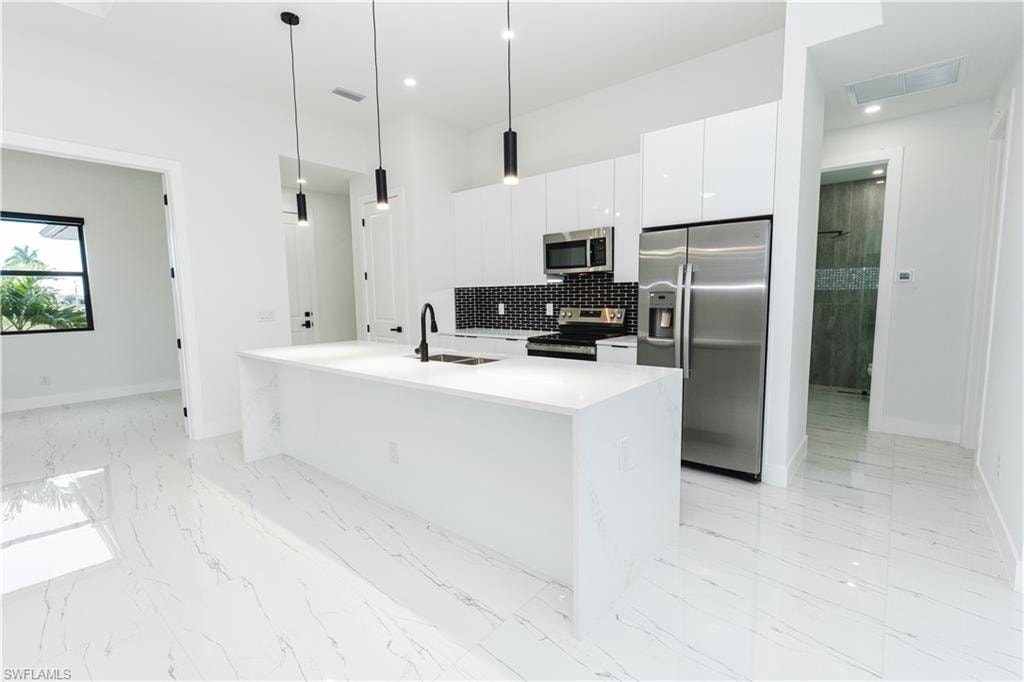 Empty room with light marble finish flooring and baseboards