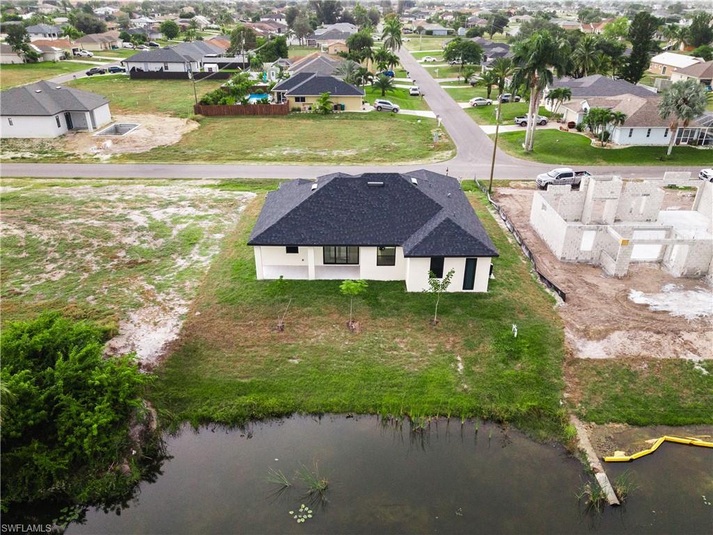 Aerial view of residential area with a large body of water