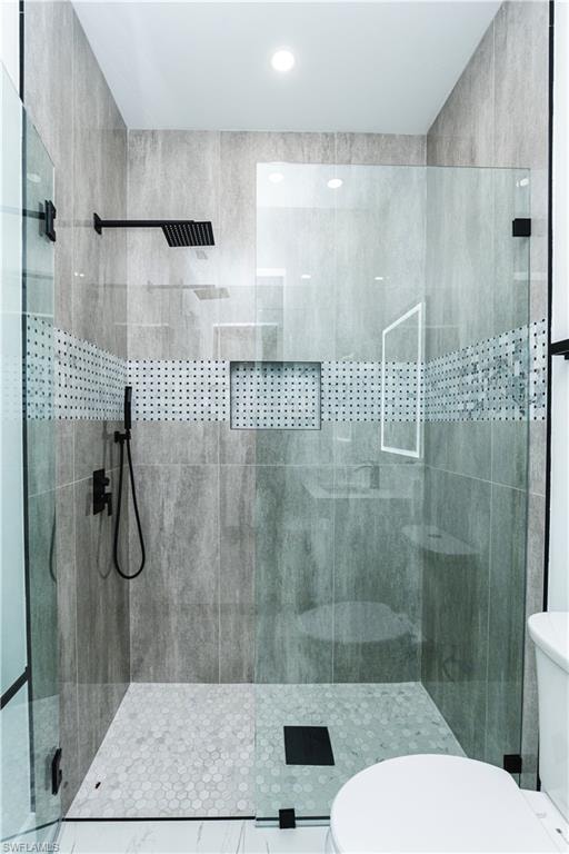 Bathroom with vanity and a shower stall