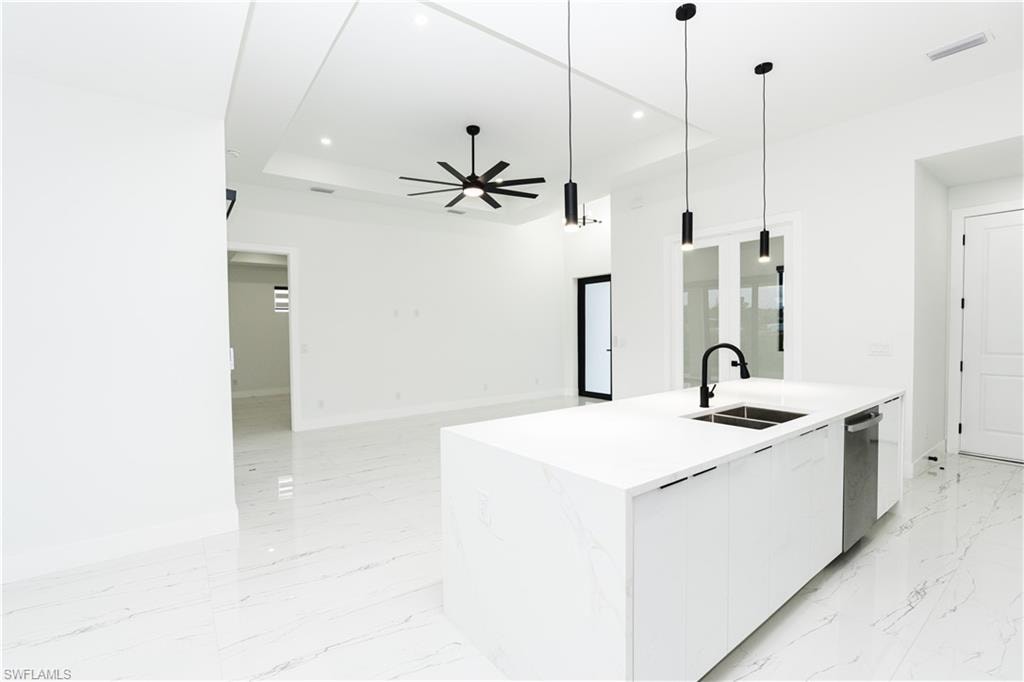 Spare room with baseboards and light marble finish floors