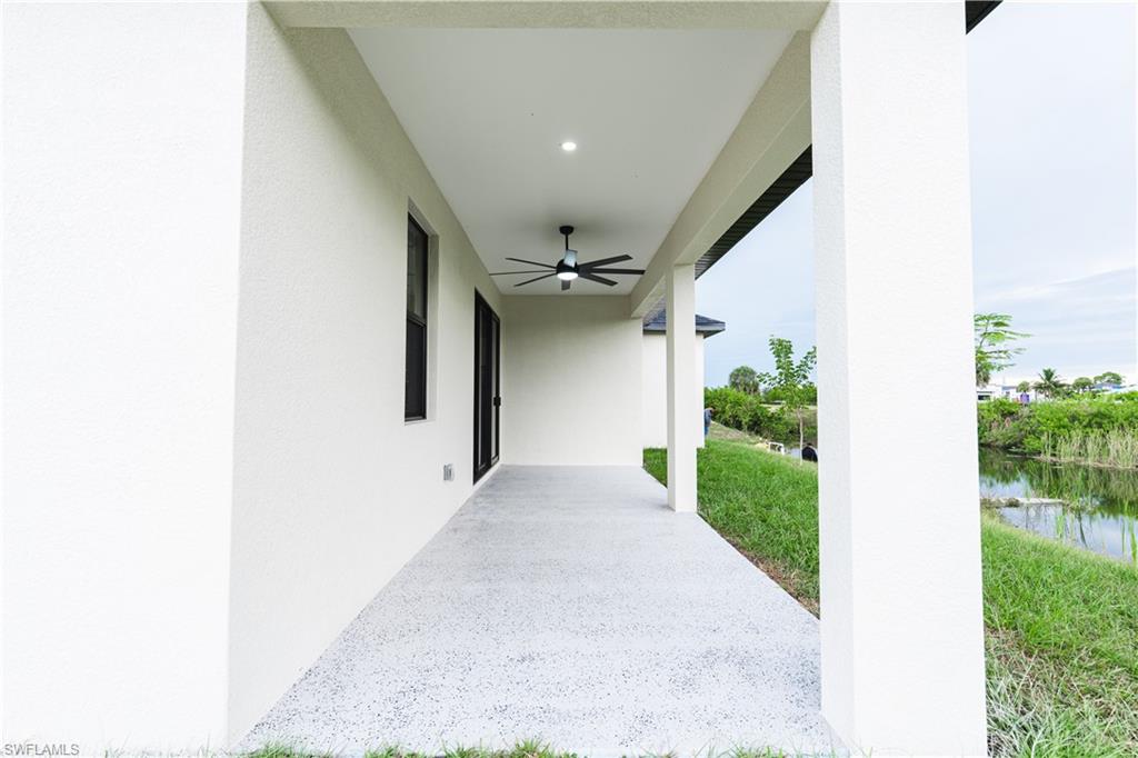 Unfurnished room with a tray ceiling, light marble finish floors, and recessed lighting