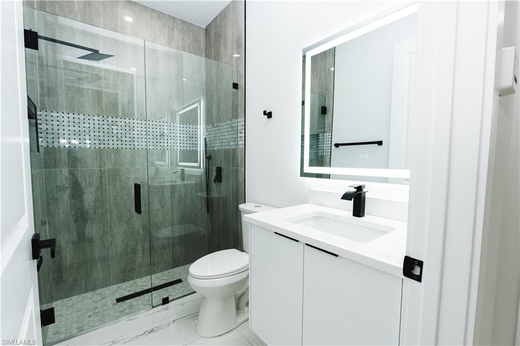 Spare room featuring french doors and light marble finish flooring