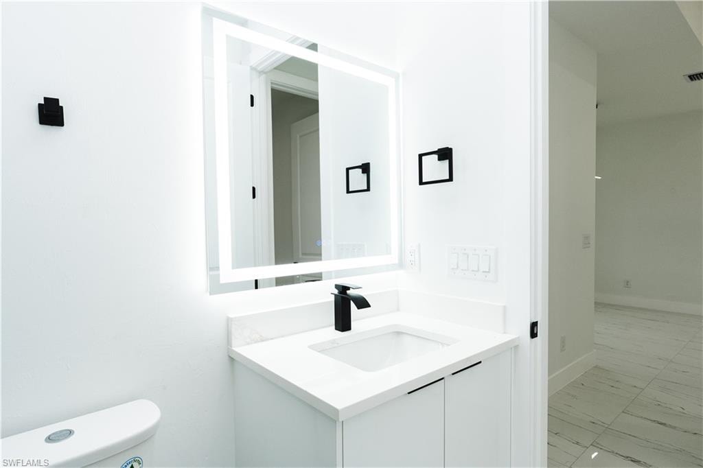 Bathroom with vanity and a shower stall