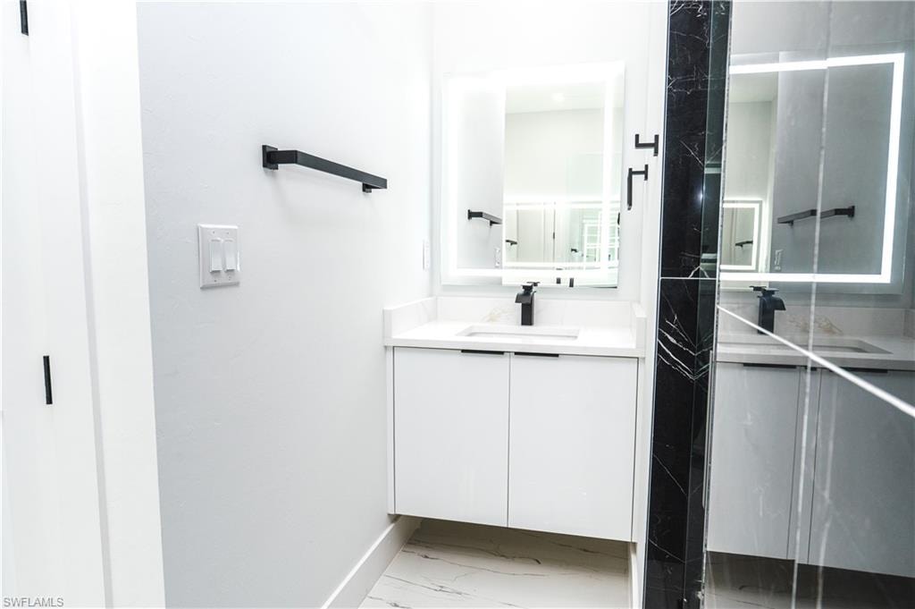 Bathroom view of a marble finish shower