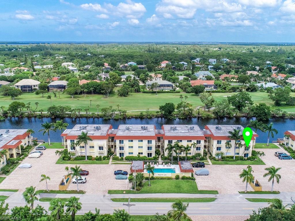 Drone / aerial view of a golf club and a large body of water