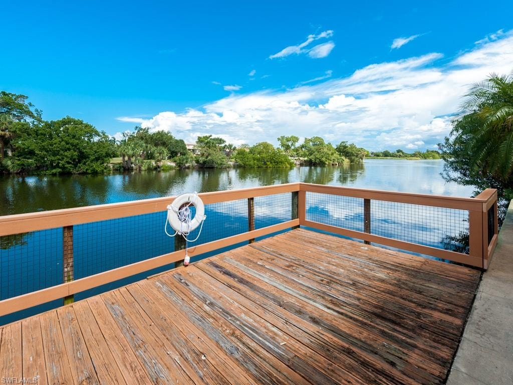 Dock area featuring a deck with water view