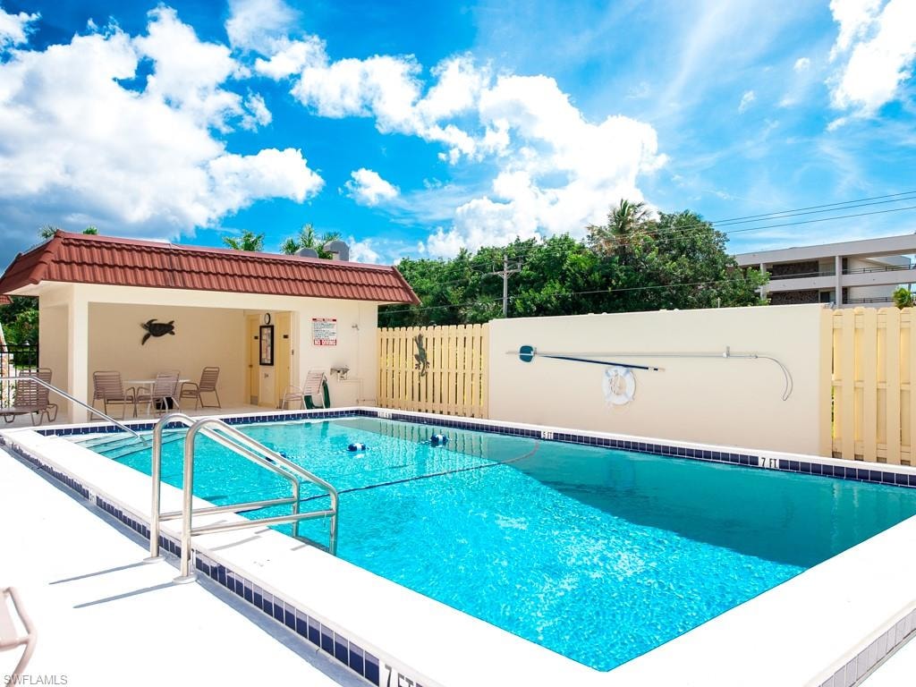Community pool with a patio area