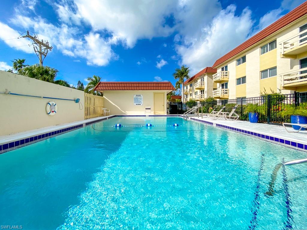 Community pool with a patio area