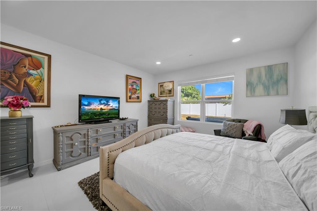 Bedroom featuring recessed lighting and light tile patterned flooring