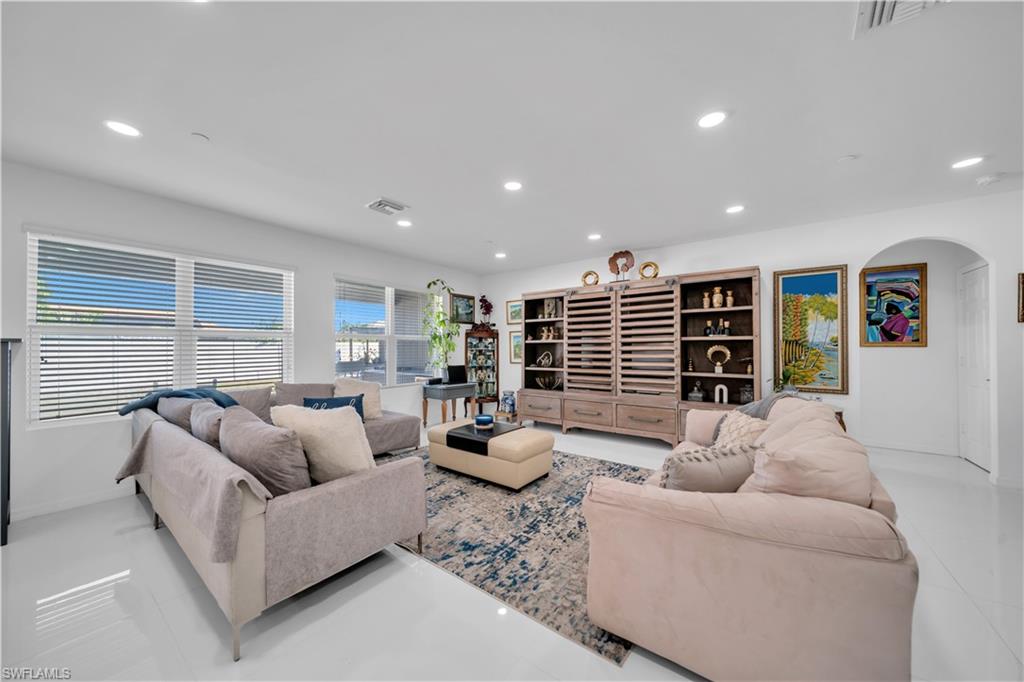 Living area featuring recessed lighting and light tile patterned floors