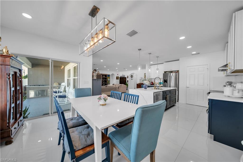 Living room featuring arched walkways and recessed lighting