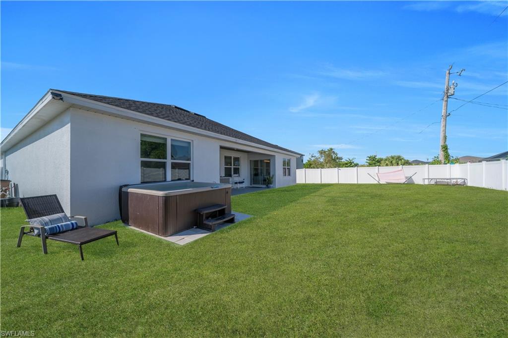Fenced backyard featuring a patio and an outdoor living space