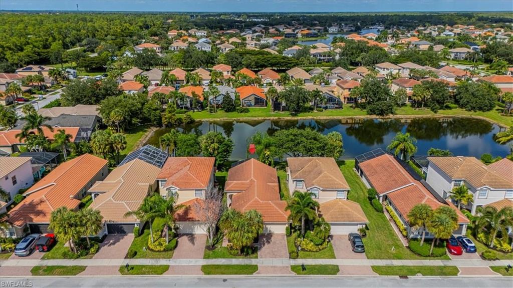 Aerial perspective of suburban area with a large body of water
