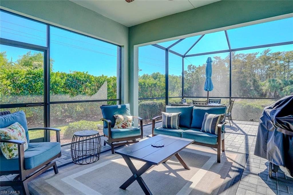 Sunroom with outdoor lounge area, plenty of natural light, and ceiling fan