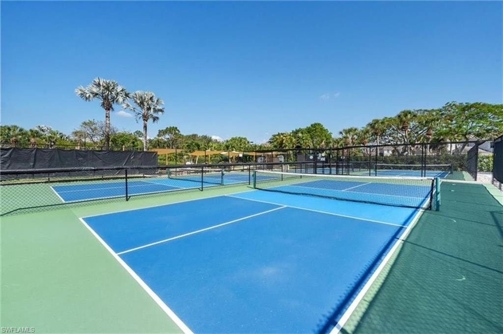 View of tennis court with community basketball court