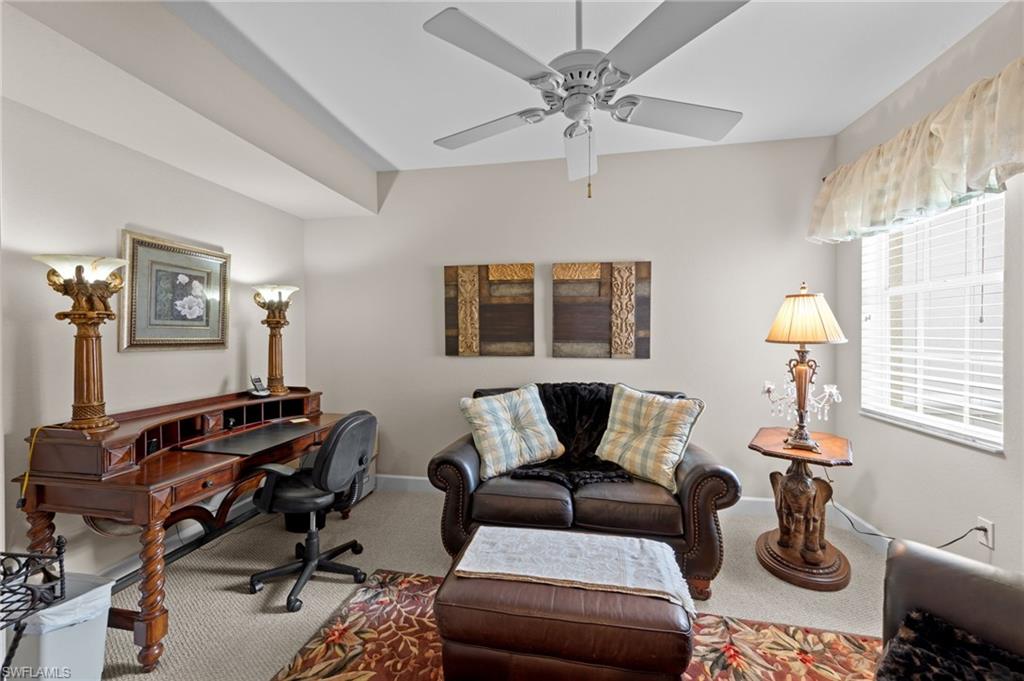 Office area featuring carpet and a ceiling fan
