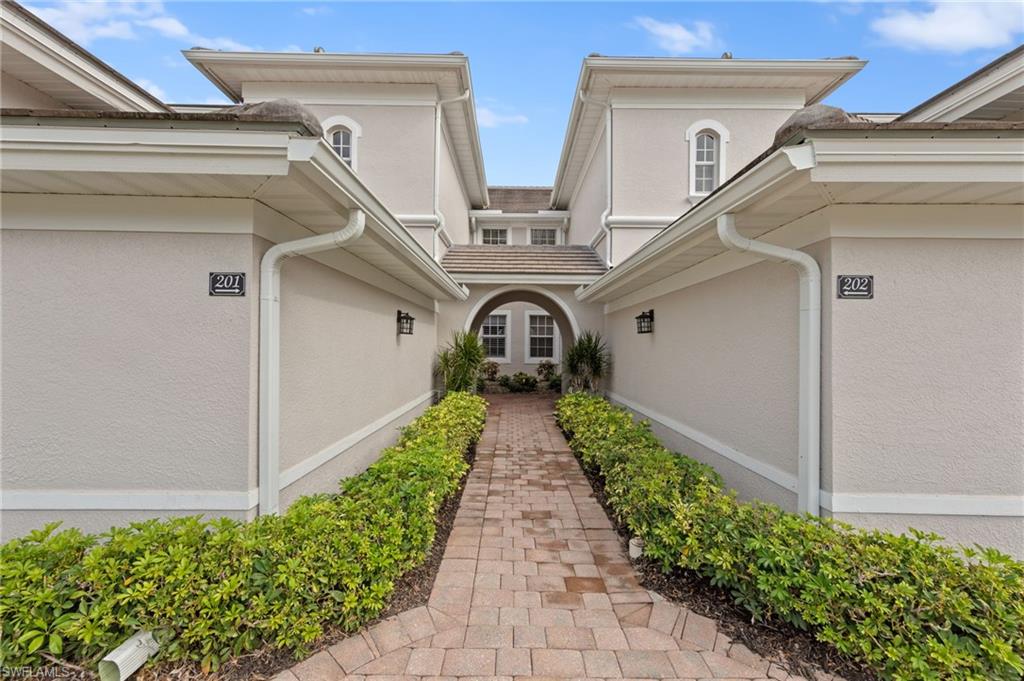 Doorway to property with stucco siding