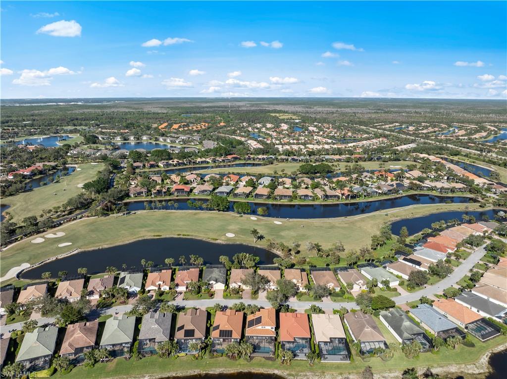 Aerial overview of property's location with a local golf course and nearby suburban area