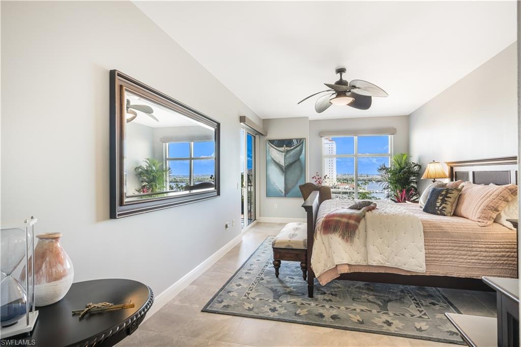 Bedroom featuring ceiling fan, access to outside, and light tile patterned flooring