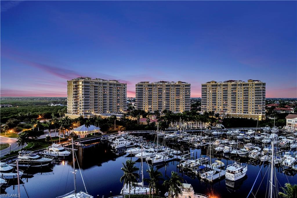 View of urban area featuring a marina and a nearby body of water