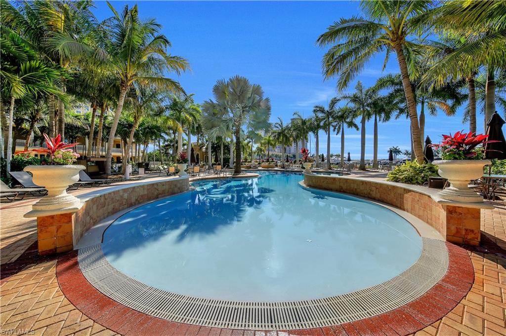 Community pool with a patio area