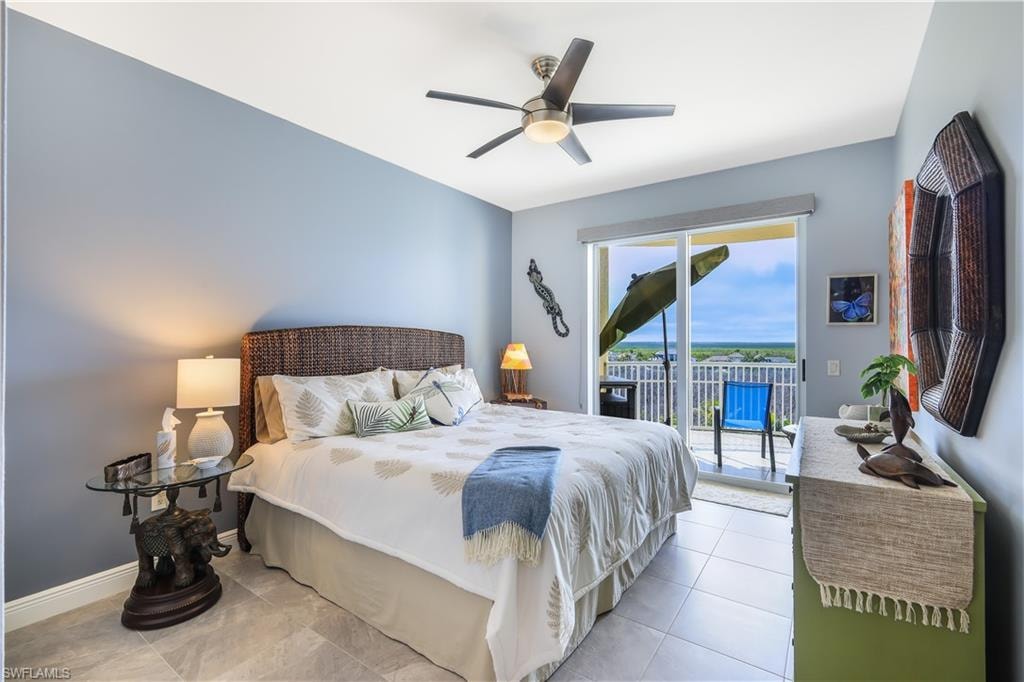 Bedroom featuring access to outside, a ceiling fan, and tile patterned floors