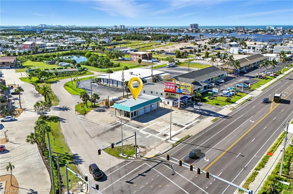 GREAT CORNER location at a signalized intersection — the busy gateway to Fort Myers Beach!