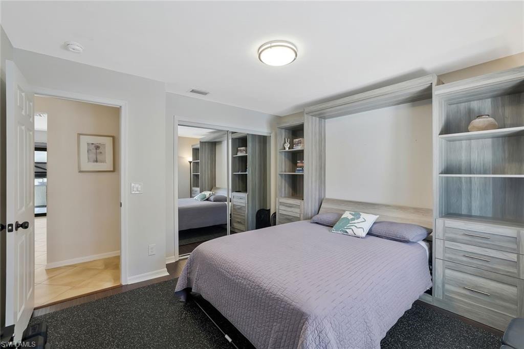 Bedroom featuring a closet and baseboards