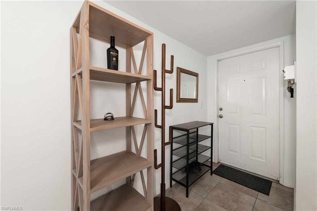 Doorway with tile patterned flooring