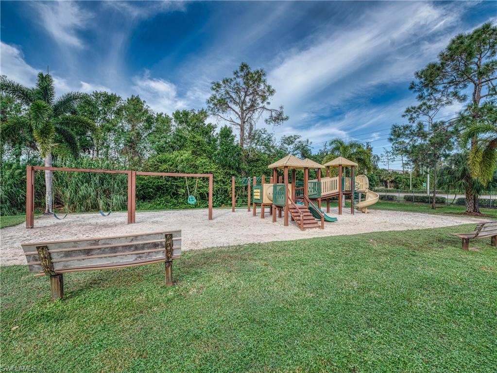 Community jungle gym with a lawn and a gazebo